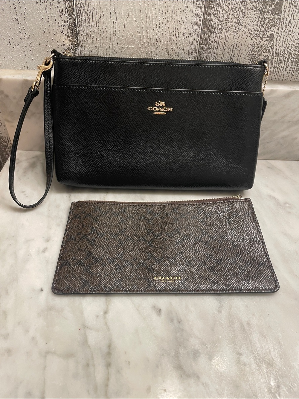 Coach Black Leather Wristlet with removable Signature Brown Coach Pouch.